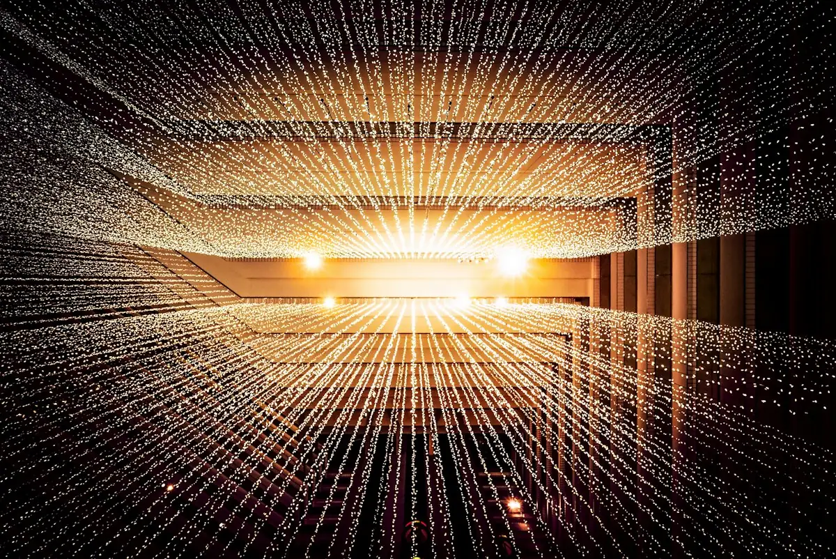 A corridor of glowing data points converging into the distance, like packets moving through a network